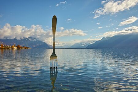 Giant steel fork in water of Geneva lake, Vevey, Switzerlandのeditorial素材