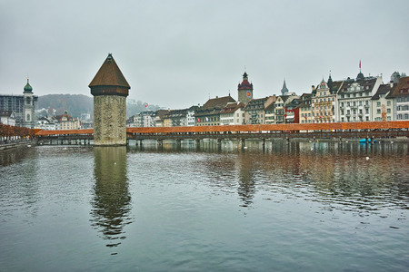 foggy morning and Chapel Bridge over Reuss River, Lucerne, Switzerlandのeditorial素材