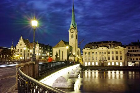 Night panoramic photo of city of Zurich and reflection in Limmat River, Switzerlandのeditorial素材