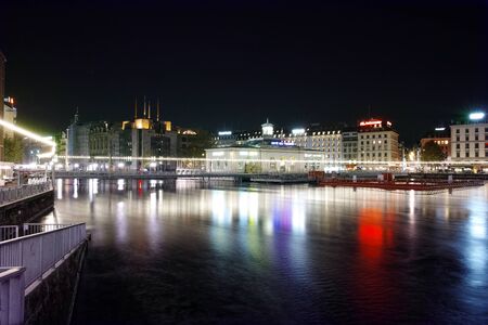 Night lights of city of Geneva and Reflectionin the lake, Switzerlandのeditorial素材