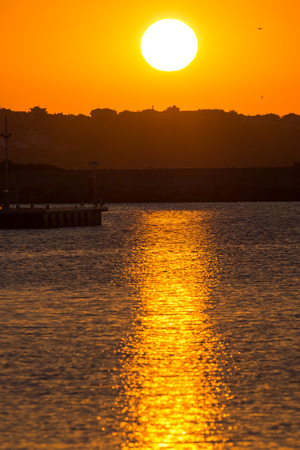 Sunset seascape with boats on the port of Sozopol, Burgas Region, Bulgariaの写真素材