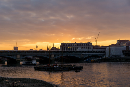 LONDON, ENGLAND - JUNE 18, 2016: Amazing sunset Cityscape from Millennium Bridge and Thames River, London, Great Britainのeditorial素材