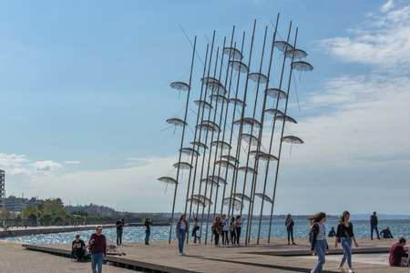 THESSALONIKI, GREECE - SEPTEMBER 30, 2017: People under Umbrellas sculpture in of of city of Thessaloniki, Central Macedonia, Greeceのeditorial素材