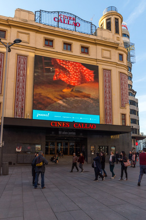 MADRID, SPAIN - JANUARY 22, 2018: Sunset view of walking people at Callao Square (Plaza del Callao) in City of Madrid, Spainのeditorial素材