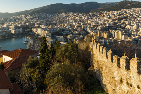 KAVALA, GREECE - DECEMBER 27, 2015: Sunset view of Ruins of fortress and Panorama to Kavala, East Macedonia and Thrace, Greeceのeditorial素材