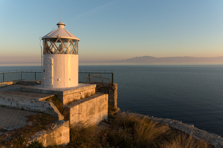 KAVALA, GREECE - DECEMBER 27, 2015: Sunset over Lighthouse in Kavala, East Macedonia and Thrace, Greeceのeditorial素材
