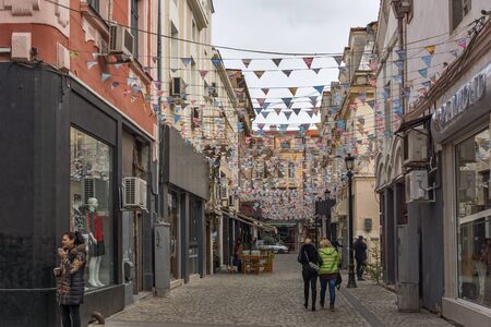 PLOVDIV, BULGARIA - DECEMBER 30, 2016:  Walking people and Street in district Kapana, city of Plovdiv, Bulgariaのeditorial素材