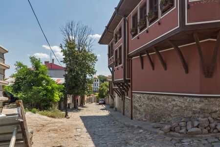 PLOVDIV, BULGARIA - JULY 5, 2018:  Cobblestone Street and Houses from the nineteenth century in old town of city of Plovdiv, Bulgariaのeditorial素材