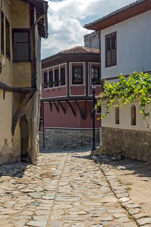 PLOVDIV, BULGARIA - JULY 5, 2018:  Cobblestone Street and Houses from the nineteenth century in old town of city of Plovdiv, Bulgariaのeditorial素材