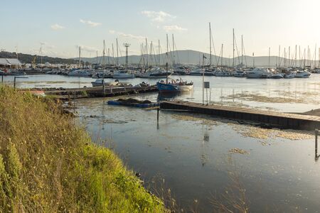 SOZOPOL, BULGARIA - AUGUST 9, 2018: Sunset seascape with Boat at port of Sozopol, Burgas Region, Bulgariaのeditorial素材