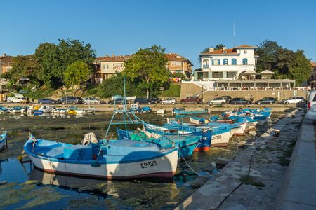 SOZOPOL, BULGARIA - AUGUST 9, 2018: Sunset seascape with Boat at port of Sozopol, Burgas Region, Bulgariaのeditorial素材