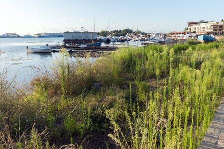 SOZOPOL, BULGARIA - AUGUST 9, 2018: Sunset seascape with Boat at port of Sozopol, Burgas Region, Bulgariaのeditorial素材