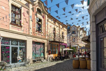 PLOVDIV, BULGARIA - JULY 5, 2018:  Street and houses in district Kapana, city of Plovdiv, Bulgaria