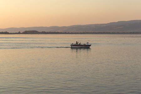 GOLUBAC, SERBIA - AUGUST 11, 2019: Amazing Sunset landscape of Danube River passing through a town...