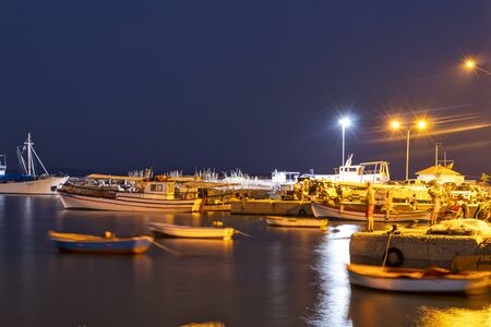 STAVROS, GREECE - AUGUST 20, 2019:  Sunset view of Coastal street of village of Stavros, Chalkidiki, Central Macedonia, Greeceのeditorial素材