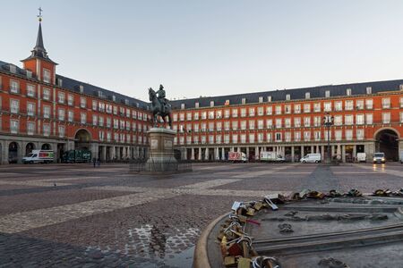 MADRID, SPAIN - JANUARY 22, 2018:  Amazing Sunrise panorama of Plaza Mayor with statue of King Philips III in Madrid, Spainのeditorial素材