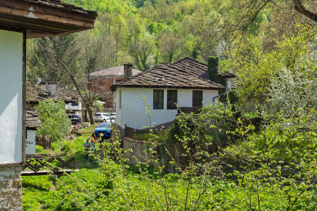Typical street and old houses at historical village of Bozhentsi, Gabrovo region, Bulgaria