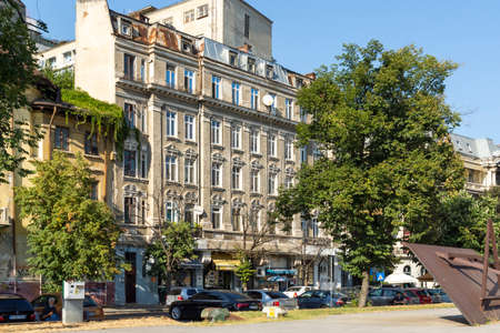 BUCHAREST, ROMANIA - AUGUST 16, 2021: Typical street and buiding at the center of city of Bucharest,...