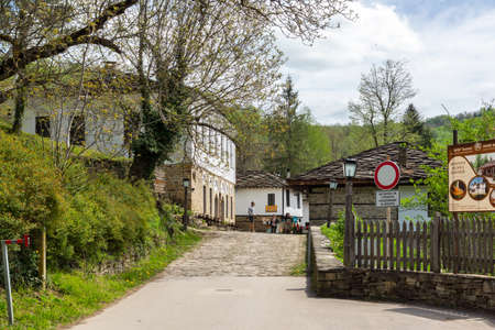 BOZHENTSI, BULGARIA - MAY 3, 2021: Typical street and old houses at historical village of Bozhentsi, Gabrovo region, Bulgariaのeditorial素材