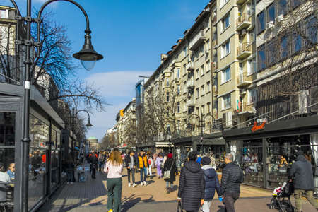 SOFIA, BULGARIA -FEBRUARY 26, 2022: Walking people on Boulevard Vitosha in city of Sofia, Bulgaria