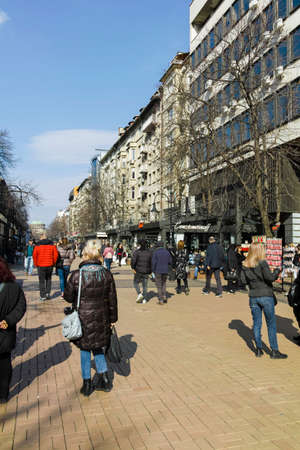 SOFIA, BULGARIA -FEBRUARY 26, 2022: Walking people on Boulevard Vitosha in city of Sofia, Bulgaria