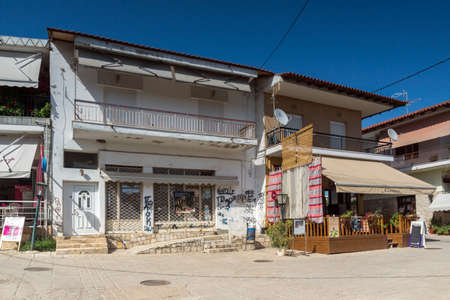 AFYTOS, KASSANDRA,  GREECE - JUNE 24, 2014: Old Houses in the historical town of Afytos, Kassandra, Chalkidiki, Central Macedonia, Greeceのeditorial素材