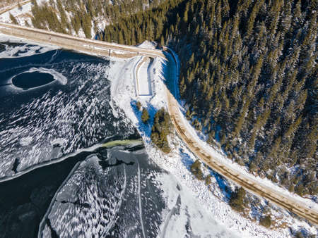 Aerial view of Golyam Beglik Reservoir covered with ice, Pazardzhik Region, Bulgaria