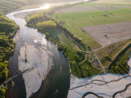 Aerial Sunset view of Struma river passing near village of Topolnitsa, Blagoevgrad region, Bulgaria