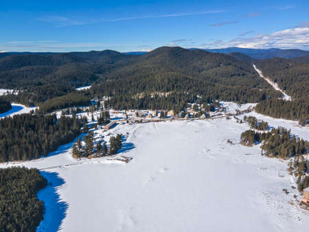 Aerial winter view of Shiroka polyana (Wide meadow) Reservoir covered with ice, Pazardzhik Region, Bulgariaの写真素材