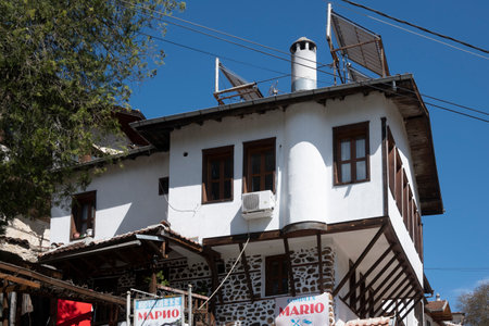 MELNIK, BULGARIA - APRIL 13, 2023: Typical street and old houses at town of Melnik, Blagoevgrad region, Bulgariaのeditorial素材