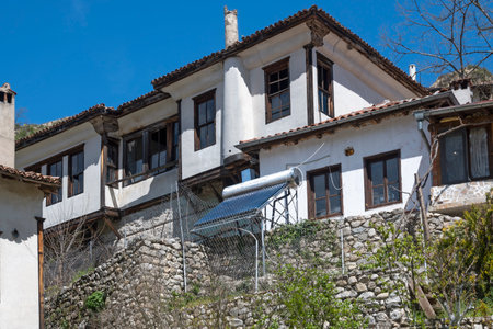 MELNIK, BULGARIA - APRIL 13, 2023: Typical street and old houses at town of Melnik, Blagoevgrad region, Bulgariaのeditorial素材