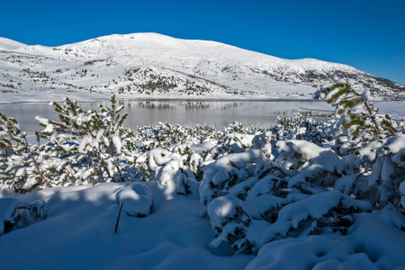 Amazing winter view of Belmeken Dam at Rila mountain, Bulgaria