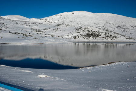 Amazing winter view of Belmeken Dam at Rila mountain, Bulgaria