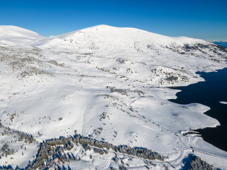 Amazing Aerial winter view of Rila mountain near Belmeken Dam, Bulgariaの写真素材