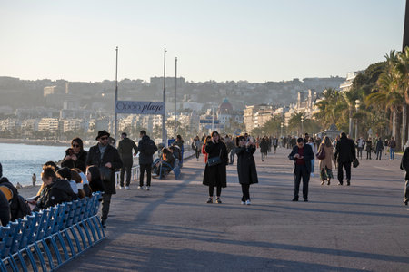 NICE, FRANCE - JANUARY 25, 2024: Sunset Panoramic view of Coastal street of city of Nice, Provence...