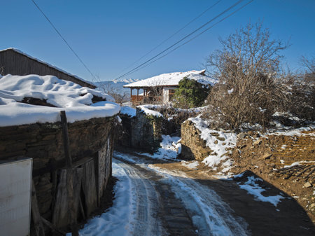 Winter view of Village of Leshten with Authentic nineteenth century houses, Blagoevgrad Region,...