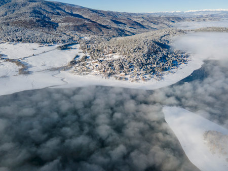 Aerial winter view of Batak Reservoir covered with clouds, Pazardzhik Region, Bulgariaの写真素材