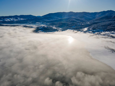 Aerial winter view of Batak Reservoir covered with clouds, Pazardzhik Region, Bulgariaの写真素材