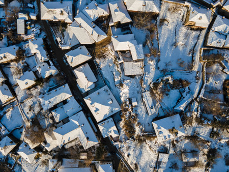Aerial Winter Sunset view of Village of Kovachevitsa with Authentic nineteenth century houses, Blagoevgrad Region, Bulgariaの写真素材