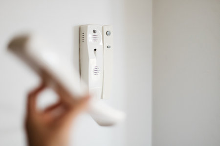 white intercom on the wall in the apartment