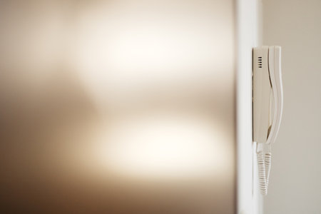 white intercom on the wall in the apartment