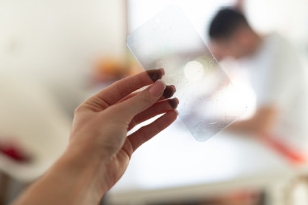 The process of replacing a protective glass on a smartphone. High quality photoの写真素材