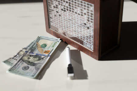 WOODEN MONEY BANK WITH GOAL COUNTER SAVING MONEY 5,000. High quality photoの写真素材
