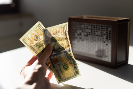 WOODEN MONEY BANK WITH GOAL COUNTER SAVING MONEY. High quality photoの写真素材