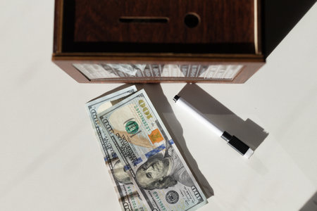 WOODEN MONEY BANK WITH GOAL COUNTER SAVING MONEY. High quality photoの写真素材