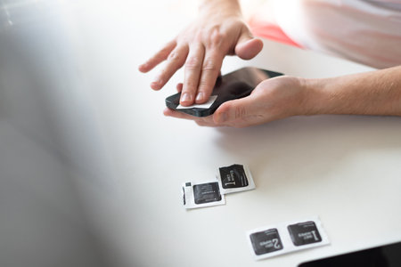 The process of replacing a protective glass on a smartphoneの写真素材