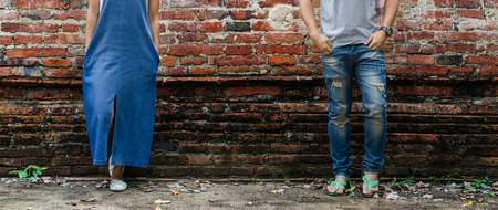 blue jeans and Denim skirt with brick backgroundの写真素材
