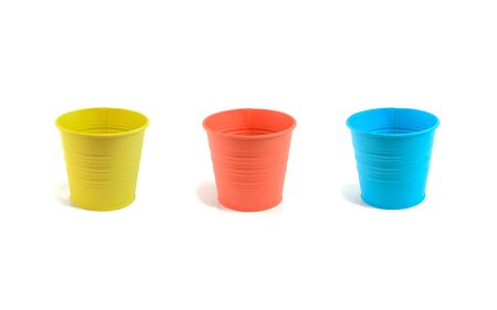 Three colored buckets isolated on white background.の写真素材
