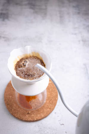 Barista was pouring hot water over the ground coffee.の写真素材