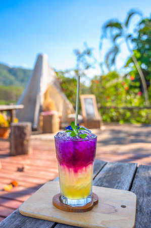 Honey Lemonade Butterfly Pea summer drink served in a highball glass. Refreshing organic drink.の写真素材
